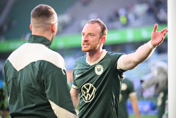 VfL Wolfsburg captain Maximilian Arnold argues with a club supporter after a Bundesliga match earlier this season.