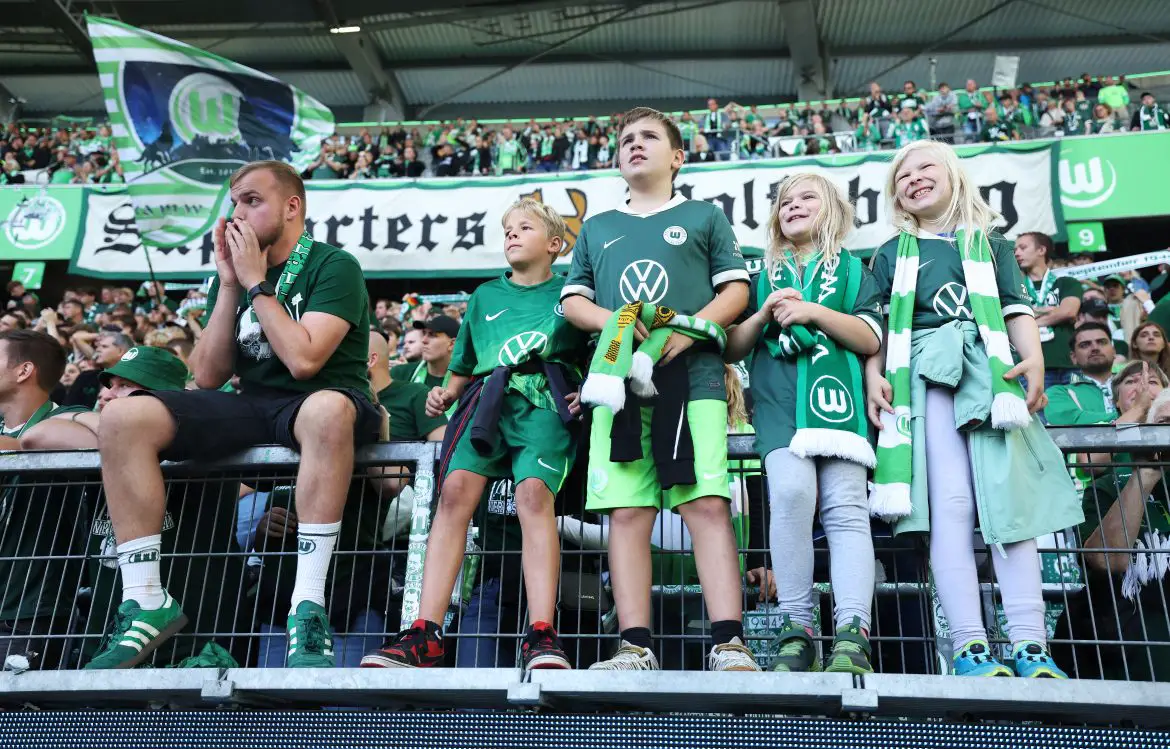 Fans of VfL Wolfsburg watching a Bundesliga match.