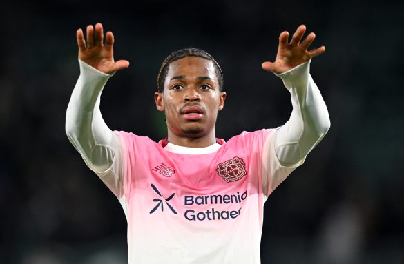 Bayer Leverkusen defender Jeanuël Belocian playing against Wolfsburg in the Bundesliga.