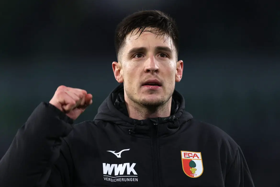 Augsburg interim captain Keven Schlotterbeck celebrates a Bundesliga victory.